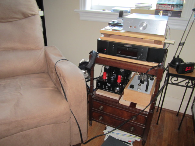 Never had it so good. An embarrassment of riches. I preferred the Musical Paradise MP-301 MK3 to the Burson (top) and it is almost as good a headphone amp as the Bottlehead Crack (right). The MP is shown here with red NOS RCA 5693s and Shuguang Black Treasure 6CA7 (EL34). Isolation devices: DIY maple. The inexpensive Marantz CD-5004 is a wonderful match. Pictured on the left, my sadly departed Beyerdynamic T1s. Amazing headphones with the MP.