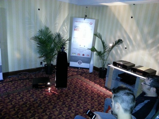 Showgoers listen mbl's room (the big electronics at right look reminiscent of Electrocompaniet's boxes. Ed)
